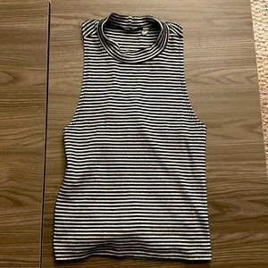 Black/white stripped shirt, high neck line.